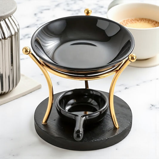 Brucia essenze nero con struttura dorata, elegante e moderno, ideale per sciogliere tart profumate e profumare la casa.